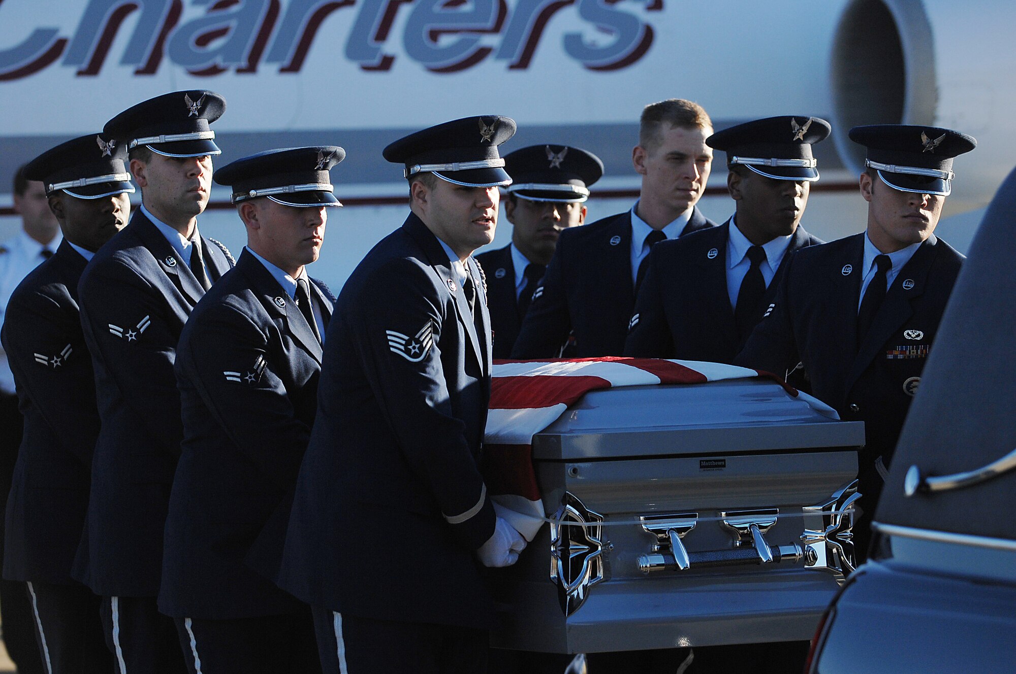 Honor guard members from the 4th Fighter Wing, perform the dignified transfer of Tech. Sgt. Adam Ginett, a fallen explosive ordnance disposal technician, on Seymour Johnson Air Force Base, N.C., Jan. 25, 2010. Ginett was assigned to the 31st Civil Engineer Squadron at Aviano Air Base, Italy. (U.S. Air Force photo/Senior Airman Ciara Wymbs)