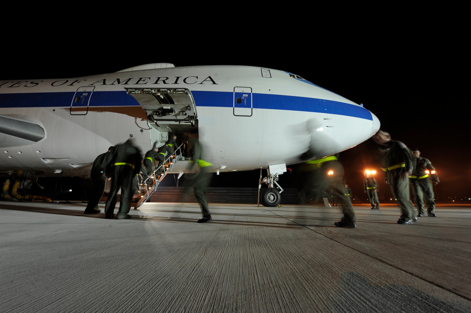 OFFUTT AIR FORCE BASE, Neb. - An aircrew from the 1st Airborne Command and Control Squadron board an E-4B here during a simulated alert mission. The E-4B is a militarized version of the Boeing 747-200 and serves as the National Airborne Operations Center for the president, secretary of defense and chairman of the Joint Chiefs of Staff. The aircraft passed a significant milestone this month by sitting alert constantly for more than 35 years.  U.S. Air Force photo by Lance Cheung 
