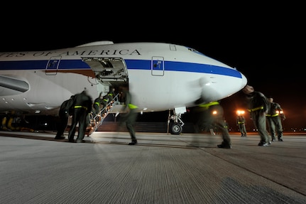 OFFUTT AIR FORCE BASE, Neb. - An aircrew from the 1st Airborne Command and Control Squadron board an E-4B here during a simulated alert mission. The E-4B is a militarized version of the Boeing 747-200 and serves as the National Airborne Operations Center for the president, secretary of defense and chairman of the Joint Chiefs of Staff. The aircraft passed a significant milestone this month by sitting alert constantly for more than 35 years.  U.S. Air Force photo by Lance Cheung 
