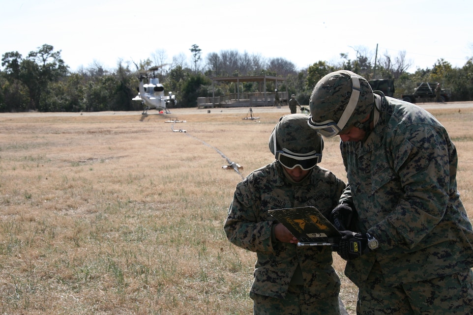 Marine Wing Support Squadron 271 bulk fuels specialists Sgt. Eric W. Reid and Cpl. James O. Turner, keep watch over a fuel meter to ensure aircraft are being fueled properly. The two Marines, along with other Marines from MWSS-27,1 participated in a forward arming and refueling point training exercise at Landing Zone Bluebird, Marine Corps Base Camp Lejeune, N.C., Jan. 27.