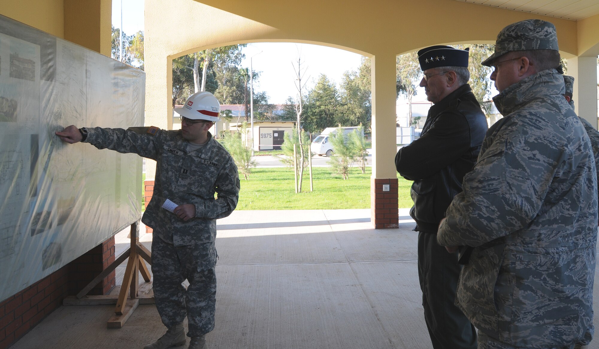Capt. Nathan Smith, deputy resident engineer of the U.S. Army Corps of Engineers, explains the changes on base housing to Gen. Roger A. Brady, U.S. Air Forces in Europe commander, and Col. Eric Beene, 39th Air Base Wing commander, Tuesday, Jan. 26, 2010 at Incirlik Air Base, Turkey.  General Brady was accompanied during the visit by Chief Master Sgt. Pamela Derrow, USAFE command chief.  (U.S. Air Force photo/Senior Airman Ashley Wood)