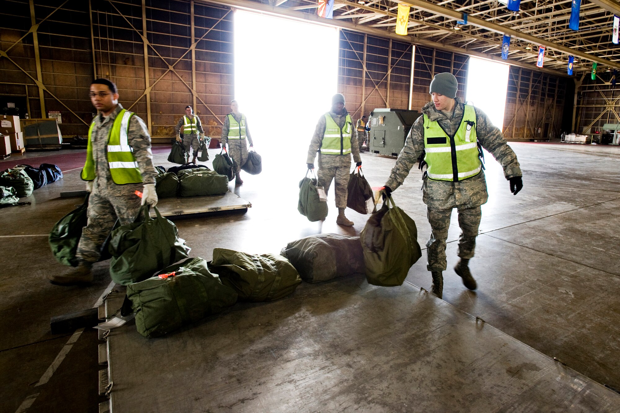 MISAWA AIR BASE, Japan -- Members of the 35th Logistics Readiness Squadron cargo deployment function prepare luggage pallets during an operational readiness exercise Jan. 27. The CDF team is responsible for ensuring cargo pallets are properly built, labeled and ready to load on transport aircraft. (U.S. Air Force photo/Senior Airman Jamal D. Sutter)