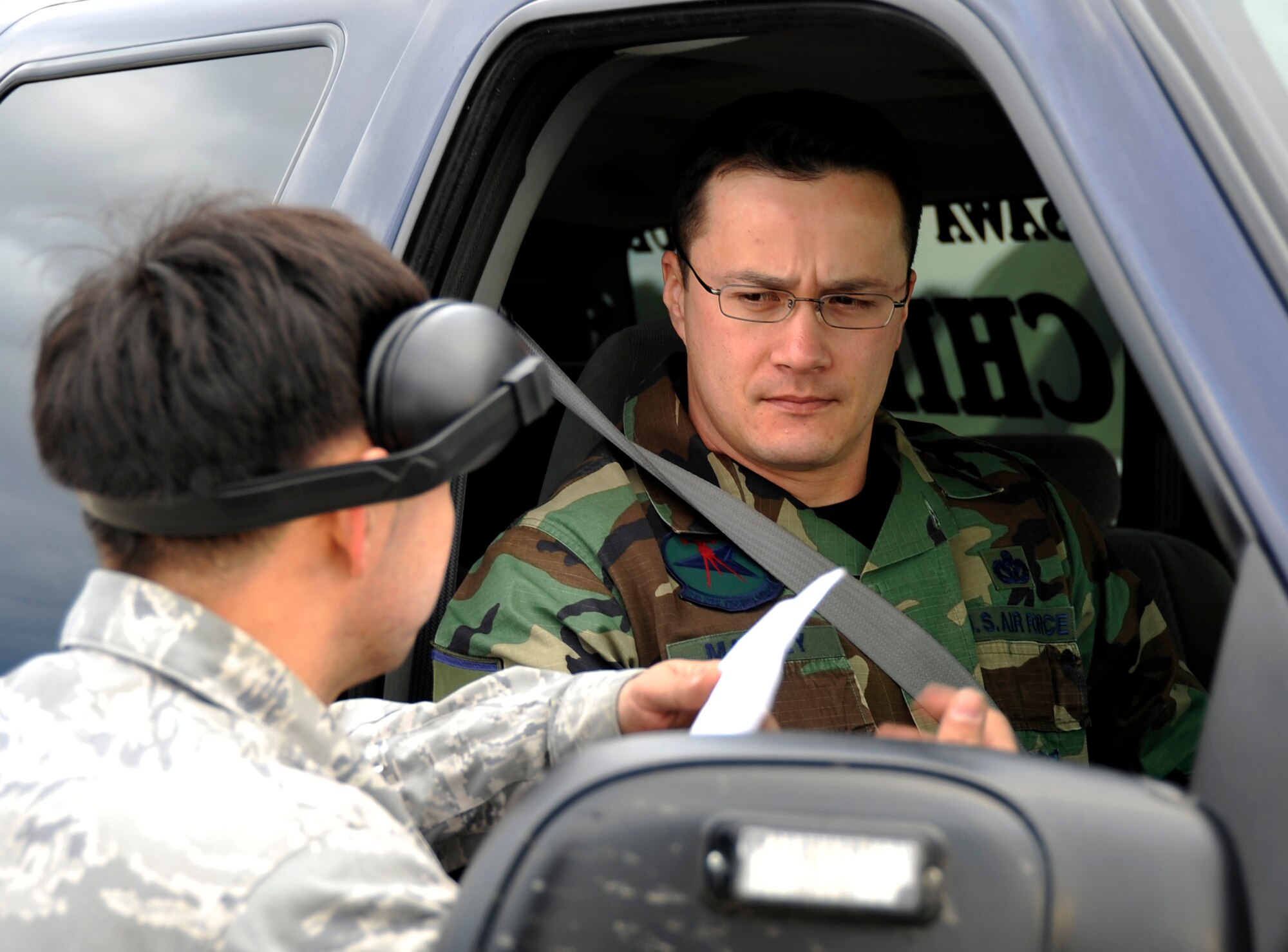 MISAWA AIR BASE, Japan -- Staff Sgt. Bradley Smith, 13th Fighter Squadron loadcrew member briefs Master Sgt. Lee Manley 35th Civil Engineer Squadron assistant chief of fire prevention, on a simulated dropped munition scenario Jan. 27 during exercise Beverly Sunrise 10-01. The exercise evaluation team inspected the responses by explosive ordnance disposal, fire and loadcrew members. (U.S. Air Force Photo/Staff Sgt. Chad C. Strohmeyer)