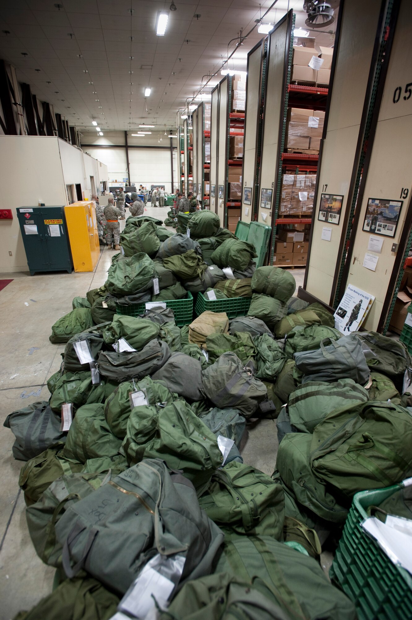 MISAWA AIR BASE, Japan -- Equipment bags line the 35th Logistics Readiness Squadron supply warehouse floor during an operational readiness exercise Jan. 27. A total of 429 bags were issued in the first 24 hours of the exercise. (U.S. Air Force photo/Staff Sgt. Samuel Morse)