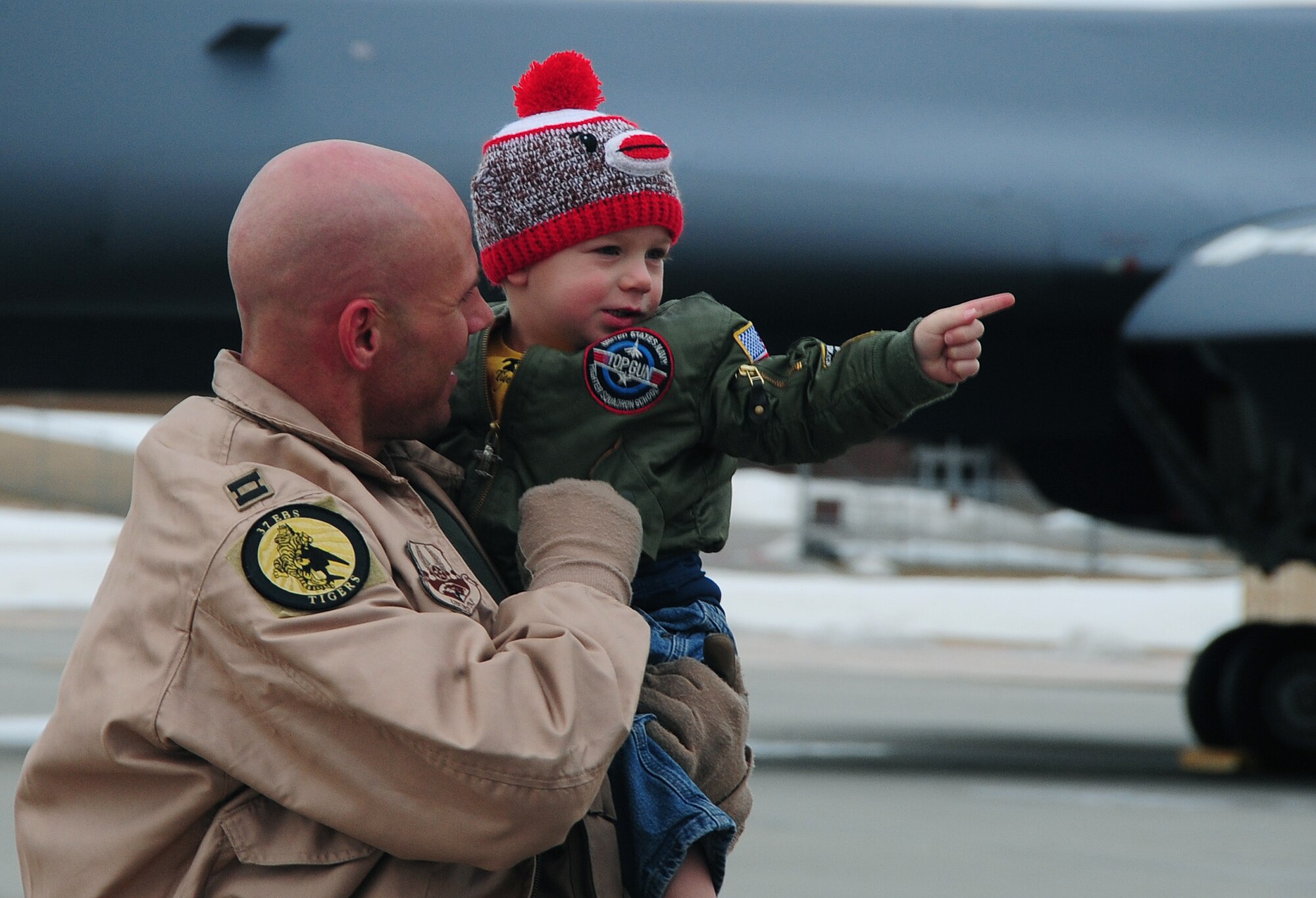 ELLSWORTH AIR FORCE BASE, S.D. -- Capt. Erick Lord, 37th Bomb Squadron weapons system officer, reunites with his son after a six month deployment in Southwest Asia.  Capt. Lord returned from his deployment in support of Operation Iraqi Freedom and Operation Enduring Freedom. (U.S. Air Force photo/Airman 1st Class Anthony Sanchelli)

