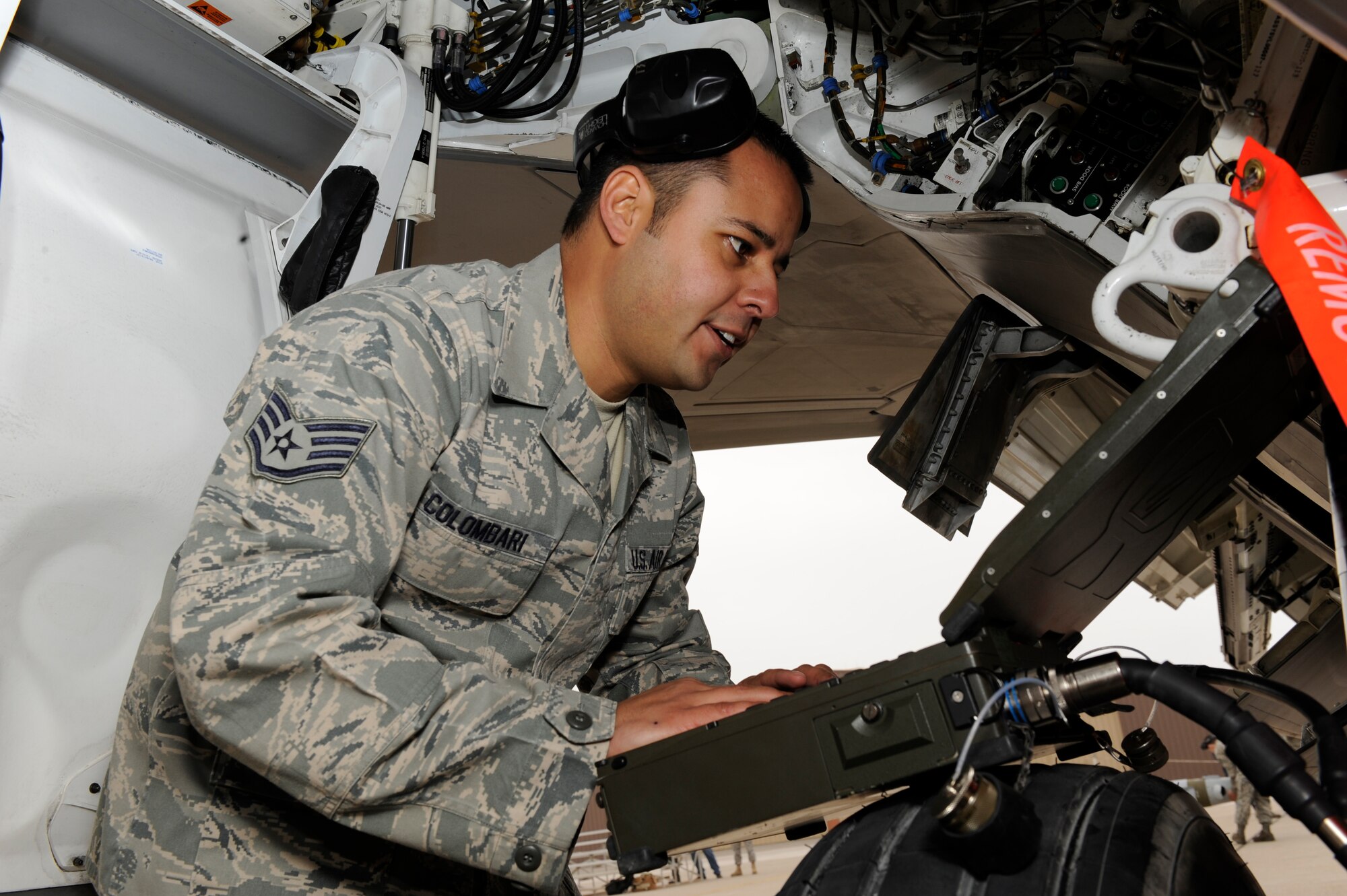 HOLLOMAN AIR FORCE BASE, N.M. -- Staff Sgt. Gino Colombari, 49th Maintenance Group, takes part in the Load Crew of the Year competition, Jan. 19. In the competition, the crews are evaluated with points deducted for safety violations, errors that could cause the weapons to function improperly and non-adherence to the established procedures. (U.S. Air Force photo by Airman 1st Class Eileen Payne)