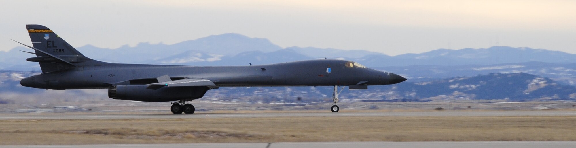 ELLSWORTH AIR FORCE BASE, S.D. -- A B-1B Lancer from the 37th Bomb Squadron taxis to an aircraft hangar here after completing six-month deployment in Southwest Asia, Jan. 26.  The B-1 can rapidly deliver massive quantities of precision and non-precision weapons against any adversary, anywhere in the world, at any time. (U.S. Air Force photo/Airman 1st Class Anthony Sanchelli)

