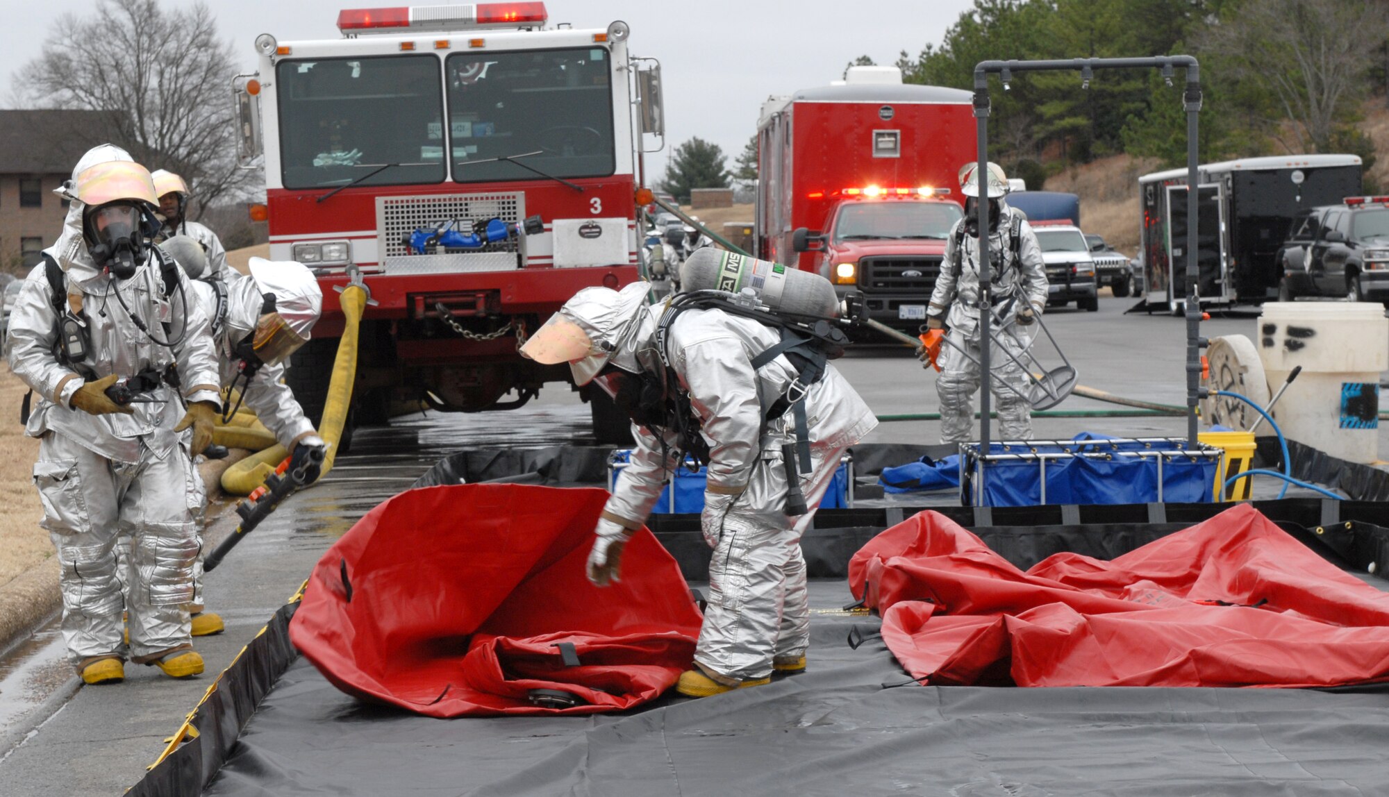 Little Rock Air Force Base firefighters set up a decontamination station after a simulated explosion during a major accident response exercise Jan. 22. As a precautionary measure firefighters administer a DECON line. (U.S. Air Force photo by Senior Airman Christine Clark)