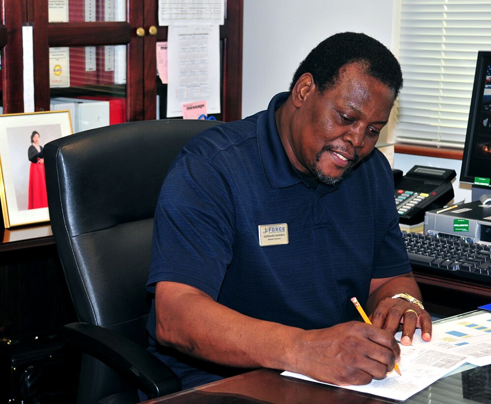 ANDERSEN AIR FORCE BASE, Guam - Gerard Barnes, athletic director for the Coral Reef Fitness Center, looks over paperwork here Jan. 21. Mr. Barnes recently won an Air Force-wide award recognizing excellence by way of a civilian.(U.S. Navy photo by Airman Jeri Moore)