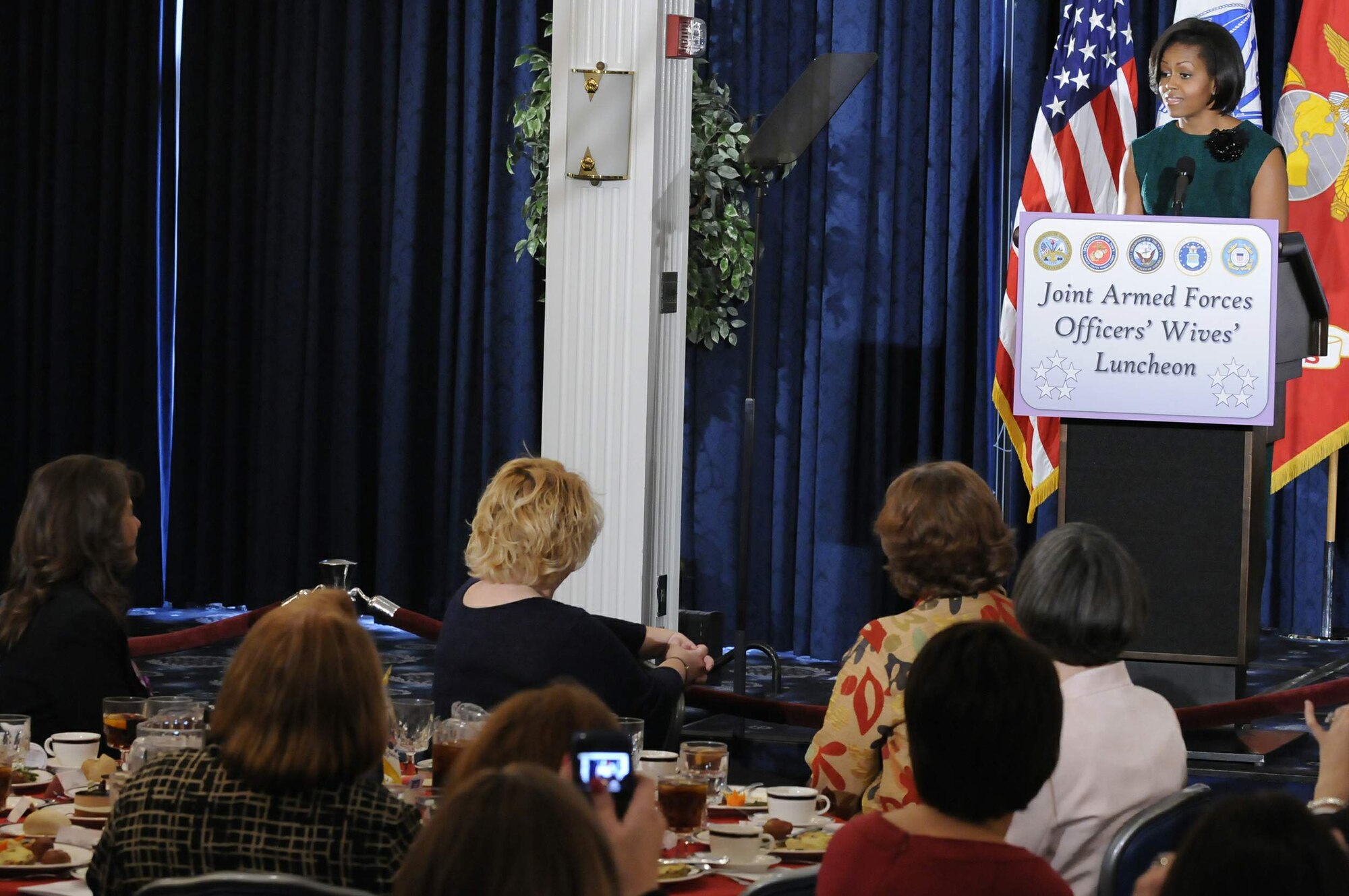 First Lady Michelle Obama speaks at the Joint Armed Forces Officers' Wives Club 32nd annual luncheon Jan. 26, 2010, at Bolling Air Force Base, D.C. Since the organization's beginning in 1977, the officers' spouses' clubs from the five military services in the Washington area form a coordinating committee to arrange the annual event. (U.S. Air Force photo/Staff Sgt. Tim Chacon)