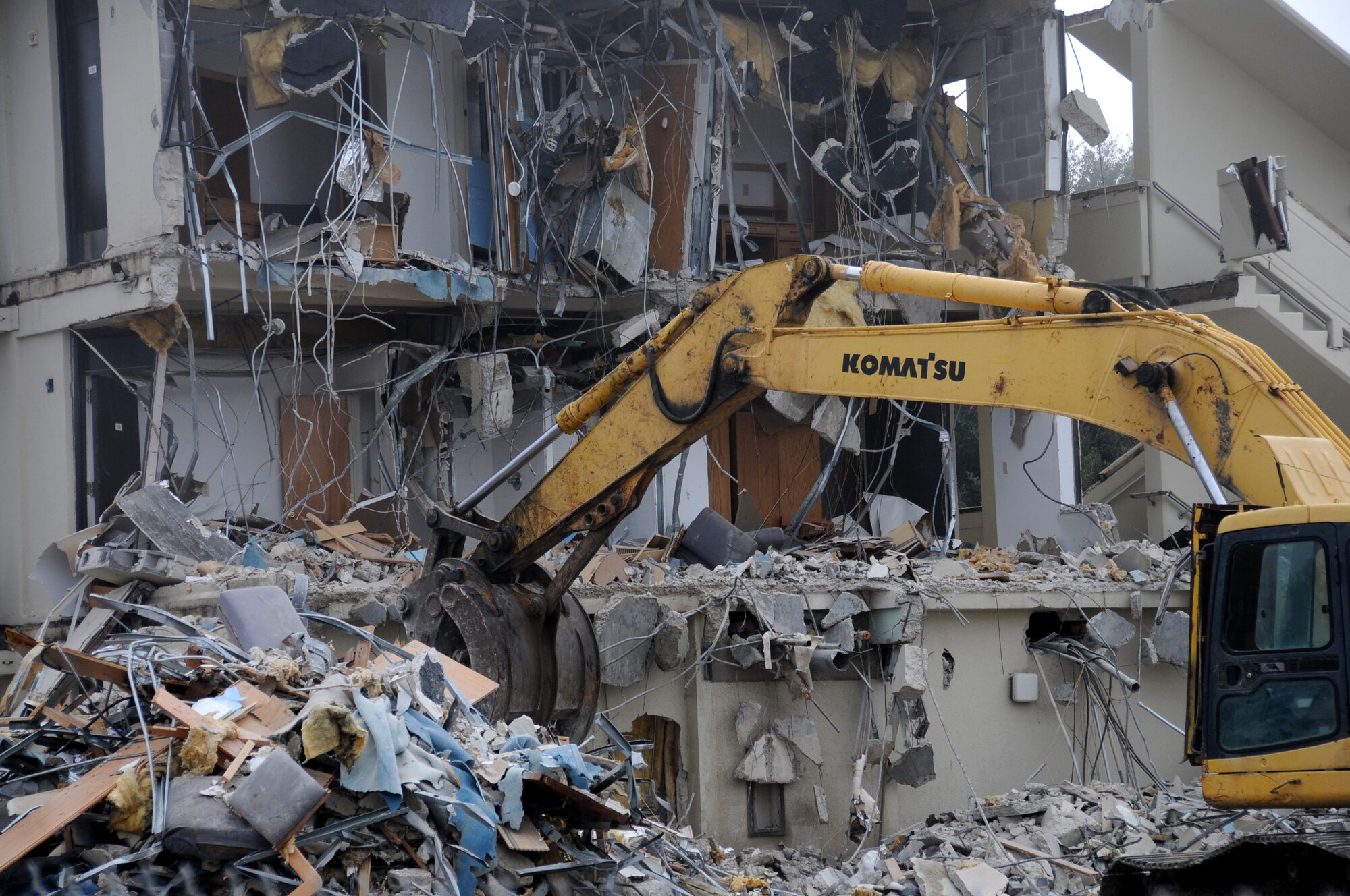 A 60-year-old former permanent party dorm is down, with another close behind. Both join the removal of the old Saber Building and old Officer’s Club as part of the Air Force’s plan to demolish 20 percent of inventory by 2020. “(These) buildings are surplus facilities,” said Don Kinman, civil engineering manager for CSC Applied Technology Group. “(The dorms) were built in the ’50s and aren’t in good condition to use for any other purpose.” Building 4811 has already been removed, and work is ongoing in demolishing Building 4817, both  located on the west side of Larcher Boulevard. The area left behind will remain green space.  (U.S. Air Force photo by Kemberly Groue)