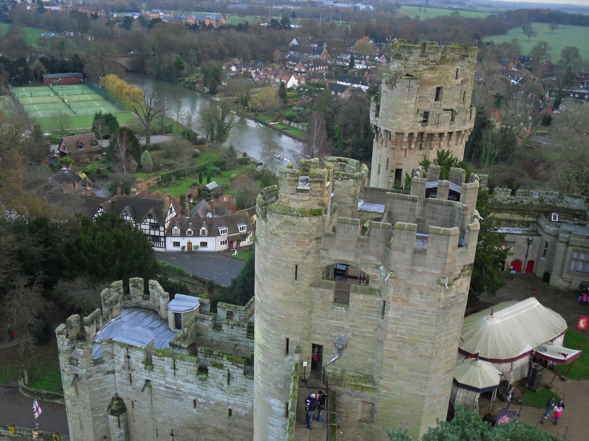Taken from the top of one of the towers, overlooks Warwick castle and the surrounding area.  Warwick Castle is located on a sandstone bluff at a bend of the River Avon in the town of Warwick. The Fortress was built in 1068 by William the Conqueror.  It’s history dates all the way back to 914 when Ethelfleda, daughter of Alfred the Great, ordered the building ordered the building of an embankment to protect the small hill top settlement of Warwick from Danish invaders.  (U.S. Air Force photo by Staff Sgt. Connor Estes)