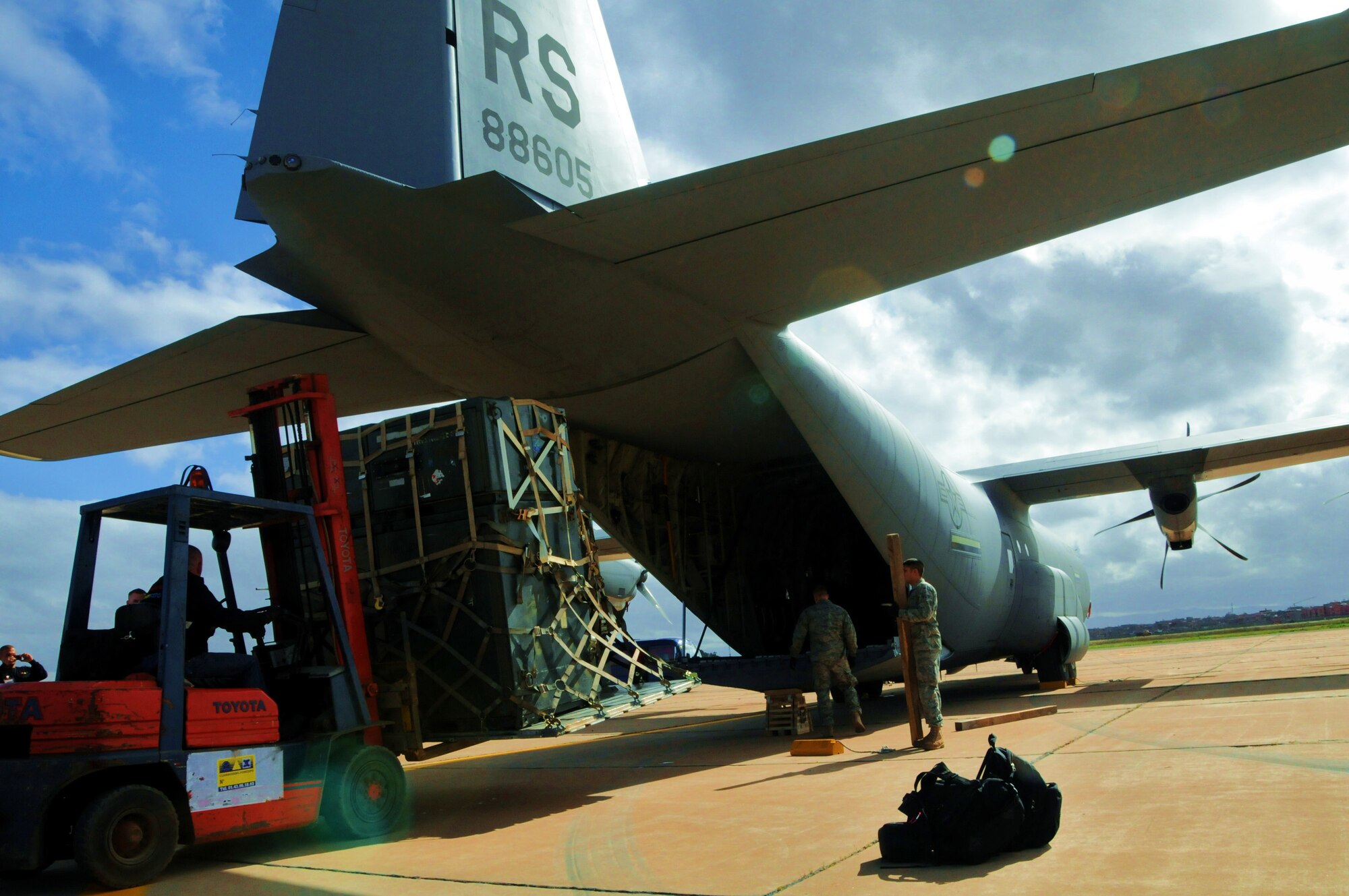 MARRAKECH, Morocco -- Cargo is removed from a C-130J Super Hercules on the Marrakech, Morocco flightline Jan. 23. The C-130J, from the 37th Airlift Wing at Ramstein Air Base, Germany, arrived for the Morocco Aeroexpo 2010. U.S. Air Force units based in the states and Europe have arrived for the event to showcase their aircraft, learn from military counterparts and building lasting relationships with African nations. Counterparts from more than 40 countries are scheduled to attend the Aeroexpo. (U.S. Air Force photo by Staff Sgt. Stefanie Torres)