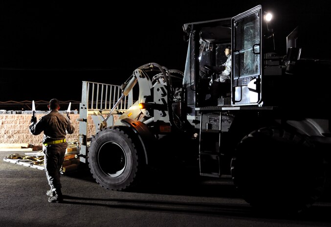 NELLIS AIR FORCE BASE, Nev. -- Airman 1st Class Kaleb Salaza, an air transportation journeyman assigned to the 99th Logistics Readiness Squadron, directs a Tunner 60K Aircraft Cargo Loader during the Operational Readiness Inspection, Jan. 25. (U.S. Air Force photo by Airman 1st Class Brett Clashman)






















  












 











































  












 
























