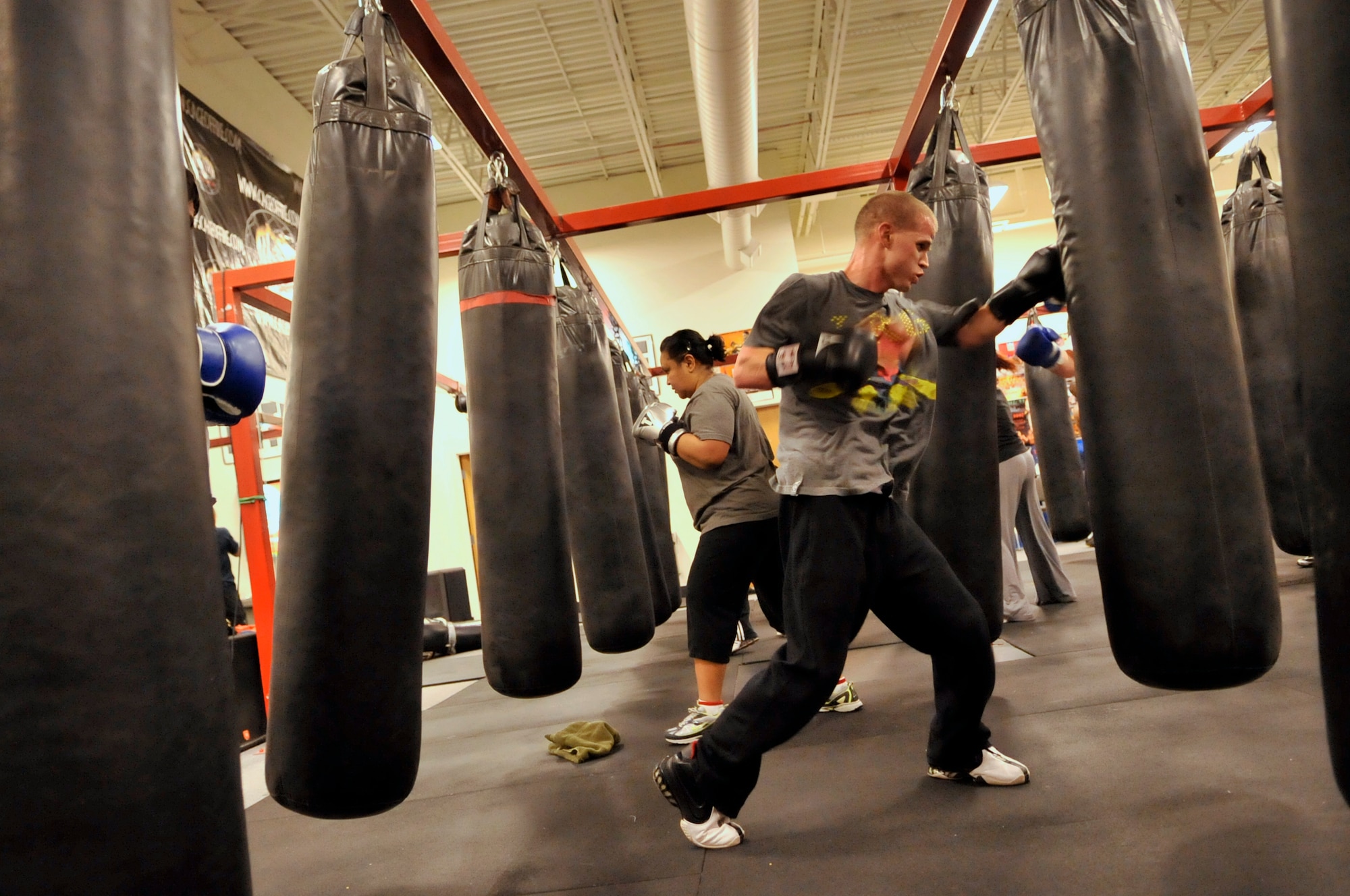 AURORA, Colo. -- Staff Sgt. Joshua Hinton, Air Reserve Personnel Center Directorate of Communications and Information knowledge operations manager, slugs it out during a fitness class at A1 Boxing Oct. 25. Boxing fitness programs are full body workouts that can burn 800 to 1,000 calories for every one hour session. (U.S. Air Force photo by Senior Airman Kathrine McDowell)