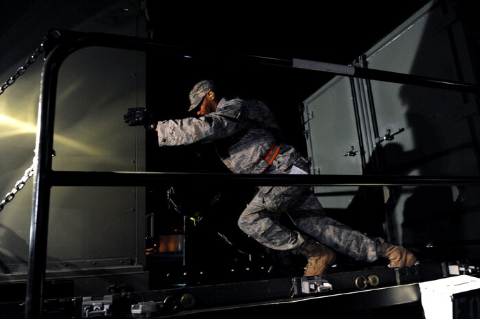 NELLIS AIR FORCE BASE, Nev. -- Staff Sgt. Daniel Limbrick, an air transporter augmentee with the 99th Medical Support Squadron, moves cargo off of a Tunner 60K Aircraft Cargo Loader towards a deck during the Operational Readiness Inspection, Jan. 25. (U.S. Air Force photo by Airman 1st Class Brett Clashman)






















  












 











































  












 
























