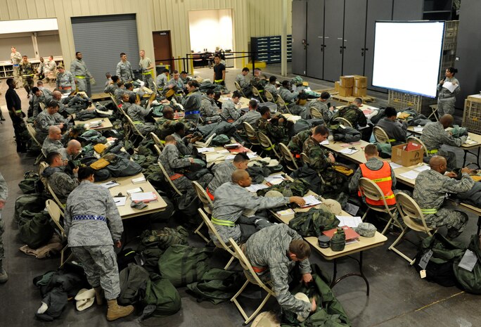 NELLIS AIR FORCE BASE, Nev. -- Airman inspect mobility bags at the deployment center during the 99th Air Base Wing Operation Readiness Inspection Jan. 25. (U.S. Air Force photo by Tech. Sgt. Michael R. Holzworth)