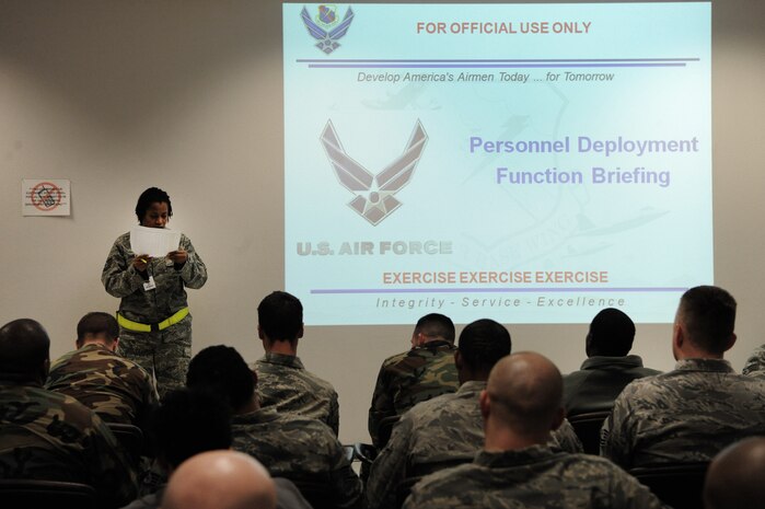 NELLIS AIR FORCE BASE, Nev. -- Tech. Sgt. Melanie Garland, 99th Force Support Squadron, takes attendance at the deployment center during the 99th Air Base Wing Operation Readiness Inspection Jan. 25. (U.S. Air Force photo by Tech. Sgt. Michael R. Holzworth)
