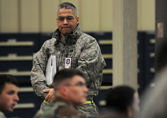 NELLIS AIR FORCE BASE, Nev. -- Capt. Brian Boseman, a logistics readiness inspector from Langley Air Force Base, Va., looks over the mass mobility bag briefing at the  deployment center during the 99th Air Base Wing Operation Readiness Inspection Jan. 25. (U.S. Air Force photo by Tech. Sgt. Michael R. Holzworth)