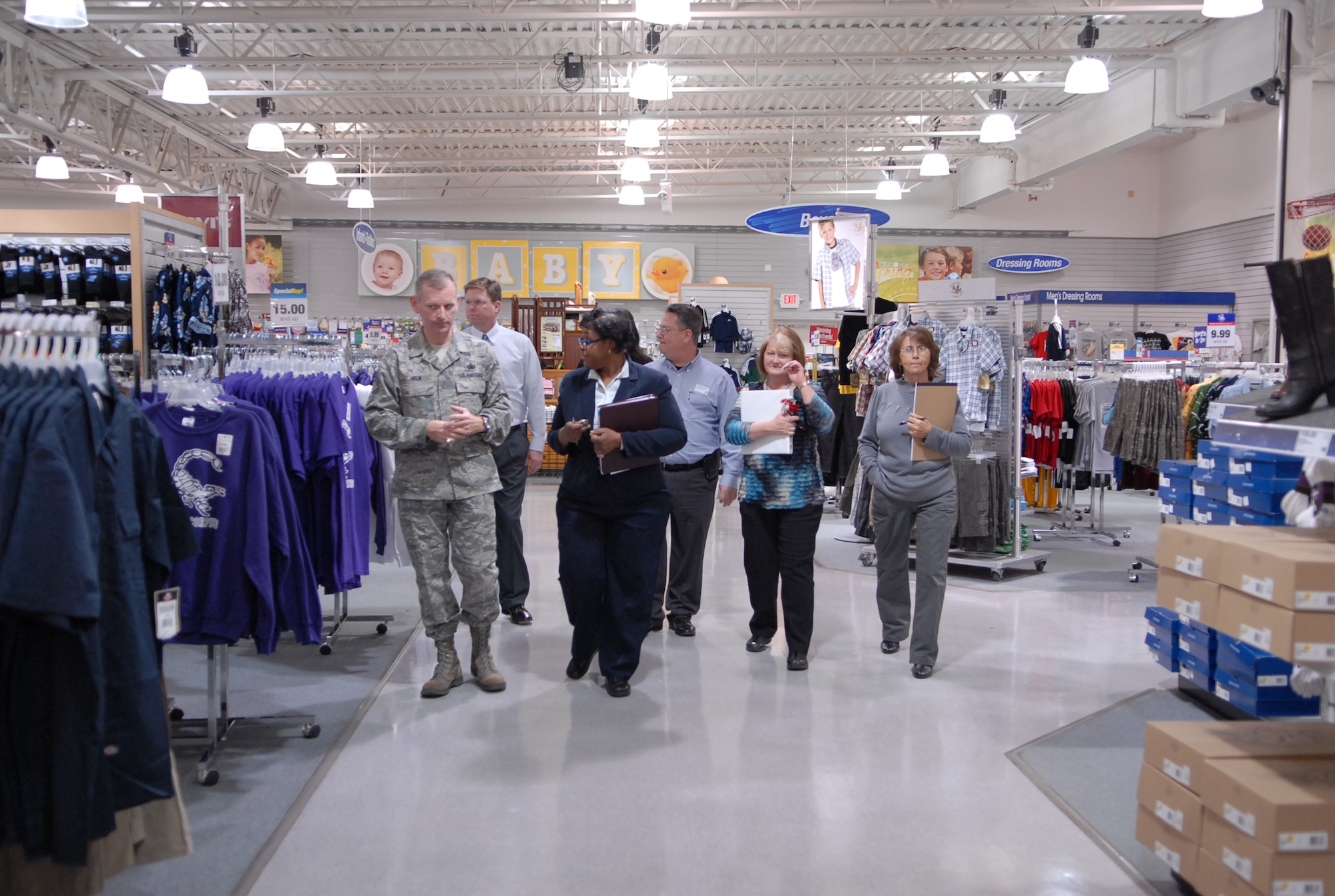 Ethel Cofield, Edwards Base Exchange Sales and Merchandise manager speaks with Chief Master Sgt. Jeffry Helm, AAFES senior enlisted advisor, during his visit to Edwards. During Chief Helms visit, he met with wing leadership, customers and toured and inspected AAFES facilities. (Air Force photo/Senior Airman Julius Delos Reyes)