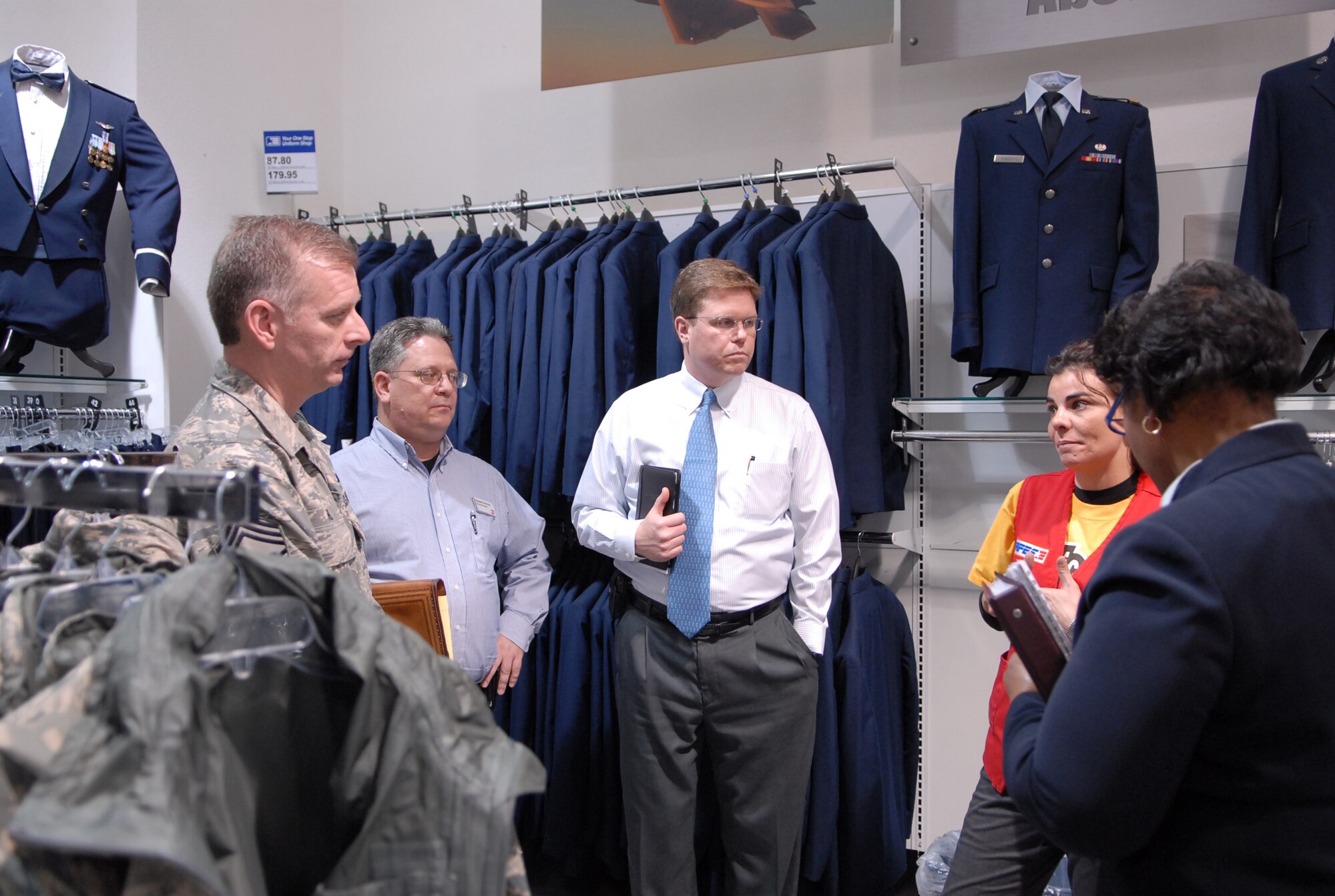 From left to right: Jeffry Helm, AAFES senior enlisted advisor, Russell Hinrichs, Edwards Base Exchange general manager, Jeff Wigness, Edwards Base Exchange area manager, Ethel Cofield, Edwards BX Sales and Merchandise manager and Eva Robinson, Edwards Military Clothing Store shift supervisor, talk in the clothing sales department during the chief's tour of Edwards BX Jan. 21. During his stay, Chief Helm met with wing leadership, Edwards Chief's Group, Edwards First Sergeant's Council along with focus groups of enlisted, officers and spouses. (Air Force photo/Senior Airman Julius Delos Reyes)
