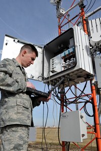 Staff Sgt. Gregory Honeywell, 744th Communication Squadron airfield systems technician, monitors system readouts from an automated weather system Jan. 21, 2010, at Joint Base Andrews. Sergeant Honeywell regularly performs preventive maintenance to ensure all equipment is running correctly. The Airmen of airfield systems maintenance perform maintenance for six bases in a 90-mile radius. (U.S. Air Force photo by Airman 1st Class Perry Aston)