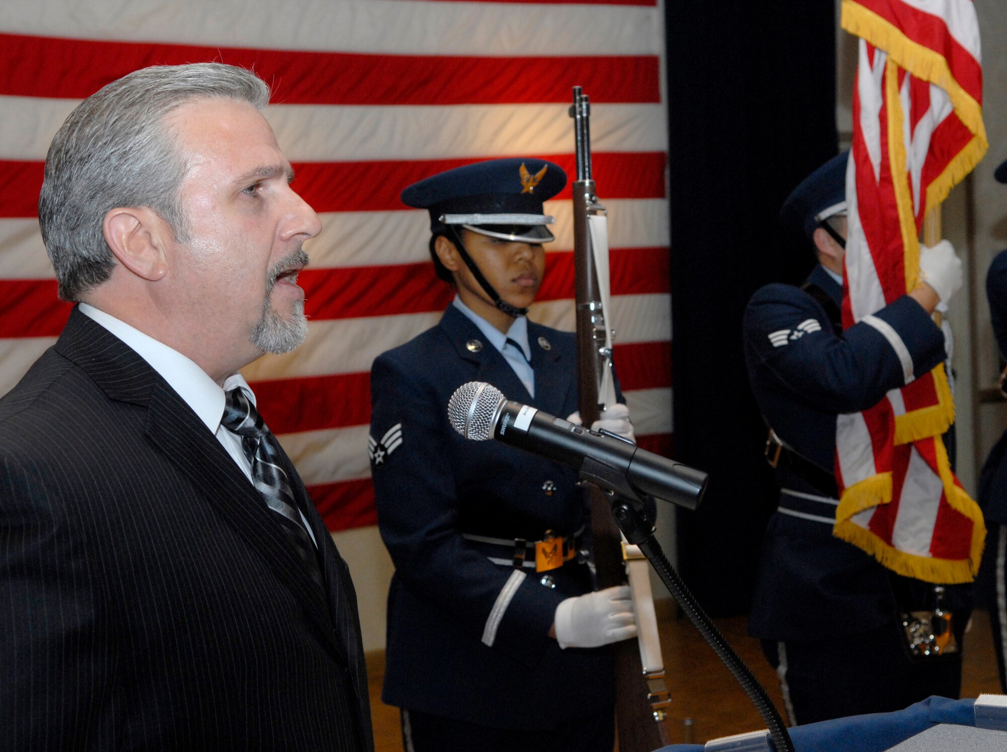 VANDENBERG AIR FORCE BASE, Calif. – Chief Master Sgt. (Ret.) Mike Syintsakos sings the National Anthem during the Chief Recognition Ceremony on Friday, Jan. 22, 2010, at the Pacific Coast Club here. (U.S. Air Force photo/Senior Airman Ashley Reed)