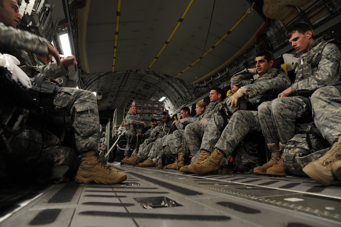 Air Force security forces  members prepare to take-off from Charleston Air Force Base on a C-17 to support relief efforts in Haiti during Operation Unified Response Jan. 22, 2010. The security forces members are from Moody AFB, Ga., and Little Rock AFB, Ark. (U.S. Air Force photo/Senior Airman Katie Gieratz)(RELEASED)