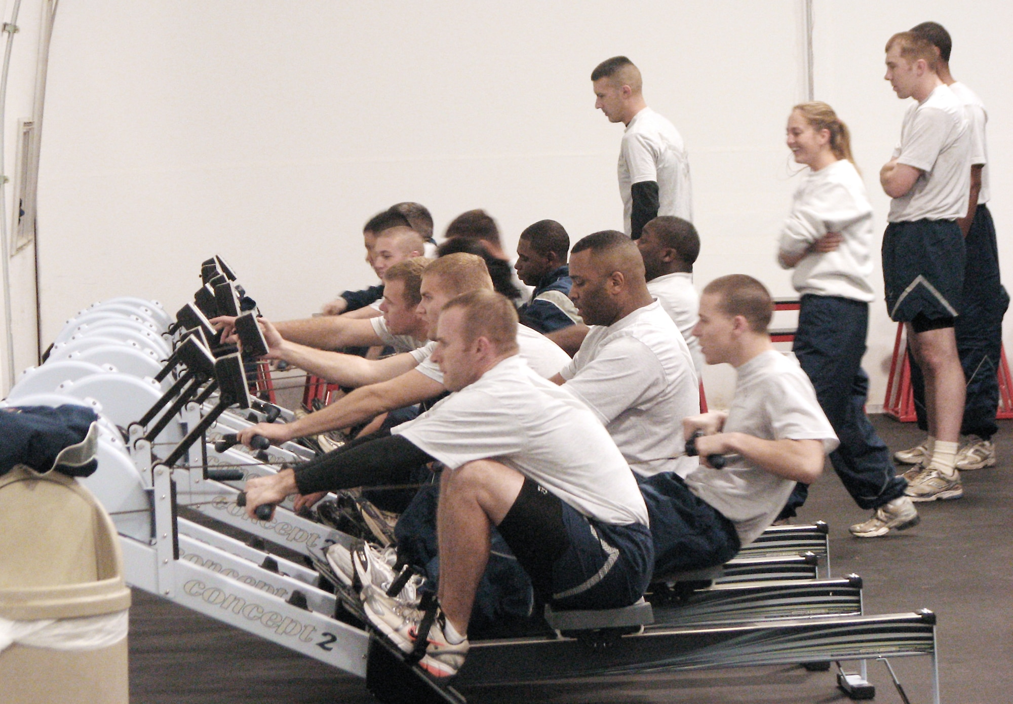 Members of the 56th Equipment Maintenance Squadron work on their endurance with the new rowing machines in an early morning physical training exercise Jan. 26, 2010, held at the Luke Air Force Base combat PT center, in Arizona. (U.S. Air Force photo)