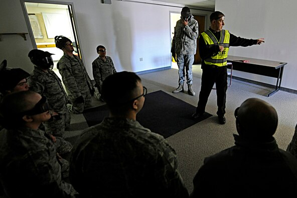 ELLSWORTH AIR FORCE BASE, S.D. -- Sgt. Mike Ghents, Pennington County Sheriff’s Department school liason officer, instructs 28th Security Forces Squadron team members prior to a training scenario, Jan. 25. The training was designed to help Airmen understand and develop tactics against armed threat scenarios. (U.S. Air Force photo/Airman 1st Class Matthew Flynn)