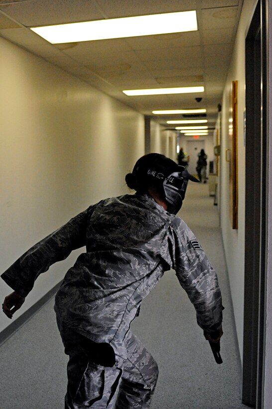 ELLSWORTH AIR FORCE BASE, S.D. -- Senior Airman Melanie Allen, 28th Security Forces Squadron team member, participates in an armed threat training scenario, Jan. 25. Airman Allen and other 28 SFS team members received specific training from the Pennington County Sheriff Department's special response team to neutralize a threat as quickly as possible. (U.S. Air Force photo/Airman 1st Class Matthew Flynn)