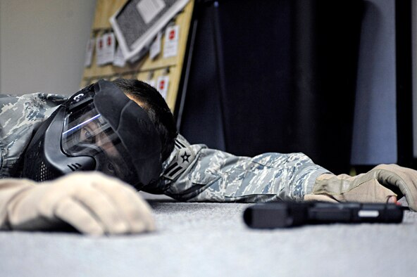 ELLSWORTH AIR FORCE BASE, S.D. -- Airman 1st Class Bryan McClellan, 28th Security Forces Squadron team member, portrays a neutralized threat during a training scenario, Jan. 25. The training was designed to help Airmen understand and develop tactics against various armed threat scenarios. (U.S. Air Force photo/Airman 1st Class Matthew Flynn)