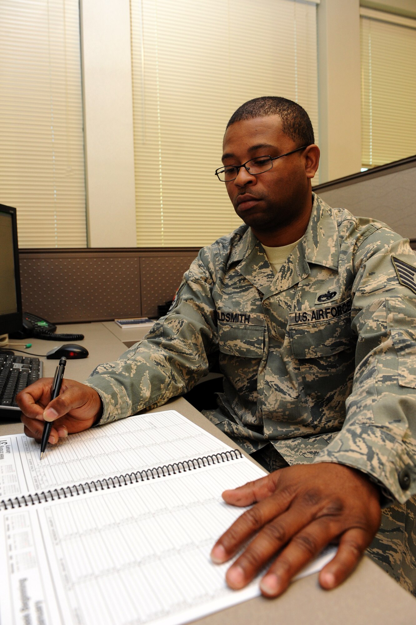 Tech. Sgt. Terrance Goldsmith, 19th Maintenance Operations Squadron maintenance analysis NCO-in-charge, updates scheduled meetings for the daily aircraft maintenance unit production meeting. He created and validated 28 weekly and seven monthly reports with data that supported the 19th Airlift Wing’s 74.3 percent average for C-130 mission capable rates for fiscal year 2009. (U.S. Air Force photo by Airman 1st Class Ethan Morgan)