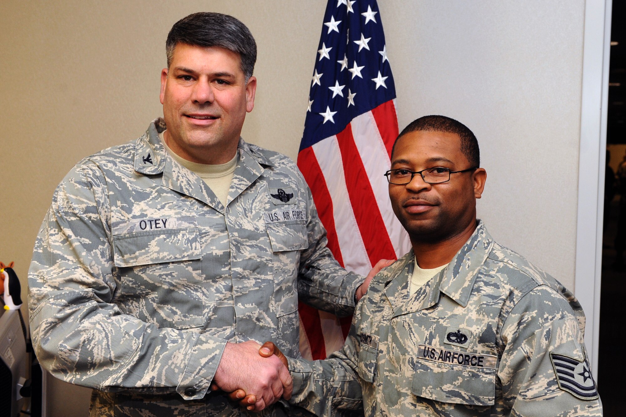 Col. Greg Otey, 19th Airlift Wing commander, presents Tech. Sgt. Terrance Goldsmith, 19th Maintenance Operations Squadron maintenance analysis NCO-in-charge, a commander’s coin Jan. 25 for being selected as the Little Rock Air Force Base Combat Airlifter of the Week. Sergeant Goldsmith was selected for being an outstanding supervisor, constantly mentoring and looking out for his Airmen while producing first-class results for his squadron and group, according to his nomination package. (U.S. Air Force photo by Airman 1st Class Ethan Morgan)