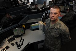 Tech. Sgt. Michael Ellard is the superintendent for the base command post with the 628th Air Base Wing. His primary duties are to implement policies, support management objectives that enable Charleston AFB to complete its mission, as well as manage training, career development, morale, fitness and mobility readiness. Since the earthquake, Sergeant Ellard stated that command post duties have increased by 50 percent, placing an extra workload on he and his Airmen. Sergeant Ellard stated that supporting the Haiti mission is very rewarding and gives him a great sense of accomplishment to see how what he is doing directly affects the mission. (U.S. Air Force photo/Senior Airman Katie Gieratz)(RELEASED)