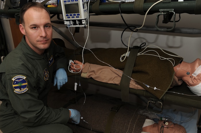 Technical Sgt. Benjamin McClain from the 315th Aeromedical Evacuation Squadron poses for a picture on Charleston AFB Jan. 16. Sergeant McClain is an aeromedical evacuation technician whose primary duties are to provide in flight patient care and to respond to in flight emergencies. Since the earthquake in Haiti Sergeant McClain has been put on alert. Sergeant McClain stated that he is for the humanitarian relief efforts, that it is what we do and what we love to do. (U.S. Air Force photo/Senior Airman Katie Gieratz)(RELEASED)