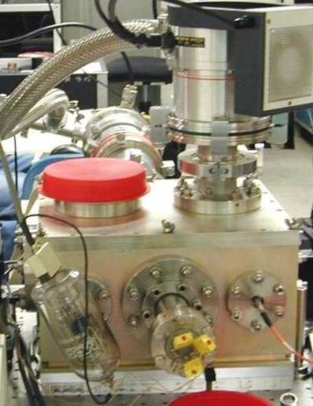 Using AFRL Multidisciplinary University Research Initiative funds, researchers created the first solid-state cryocooler (pictured) that can be applied to airborne and spaceborne sensors.  The technology enabling this new capability 
is known as optical refrigeration. (Photo Credit: Mansoor Sheik-Bahae, UNM)