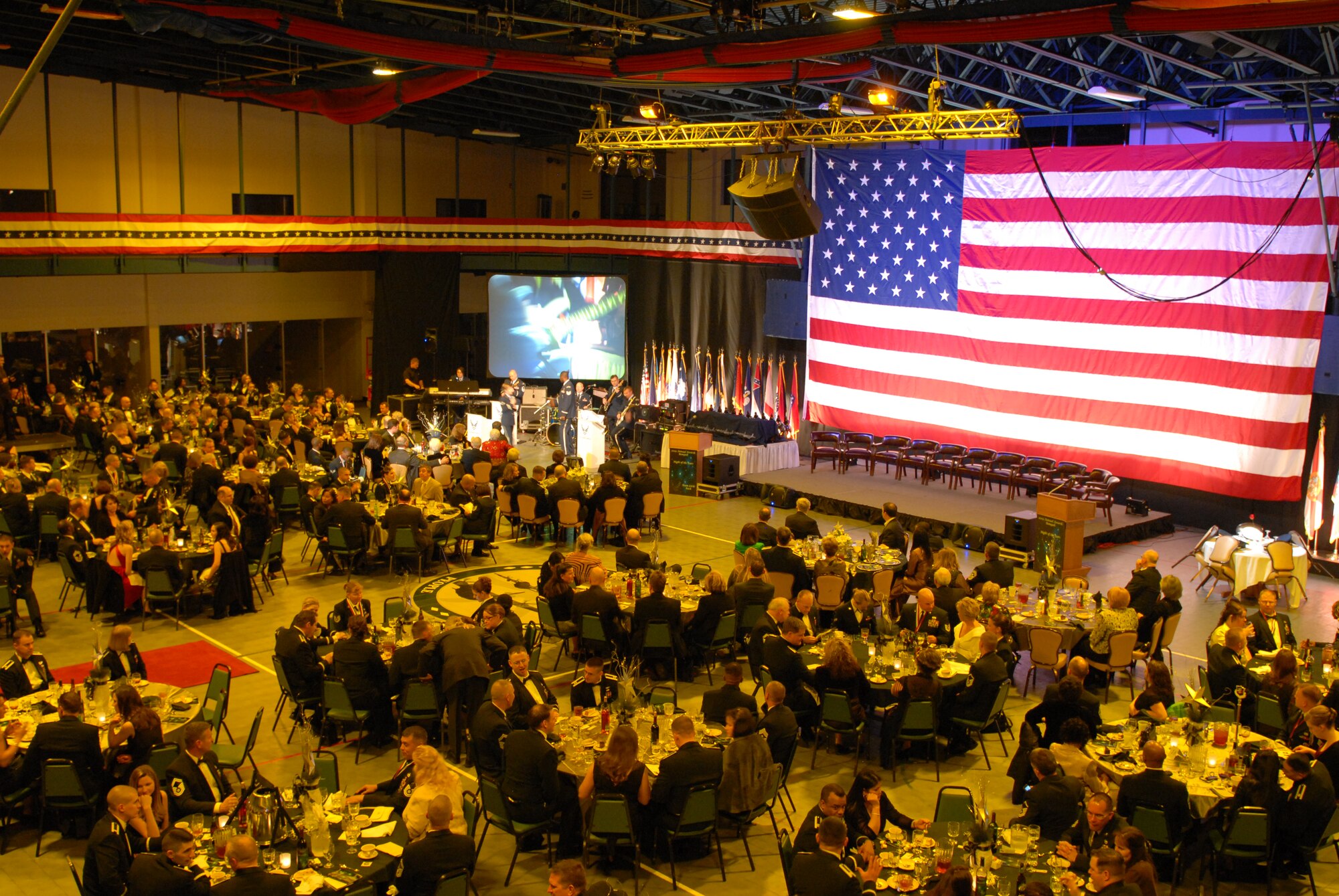 Base personnel gather in the base fitness center Jan. 22 to attend the annual awards banquet. The annual awards banquet acknowledged and awarded hard working Airmen and civilian employees around the base for their hard work and dedication. (U. S. Air Force photo by Senior Airman Christine Clark)