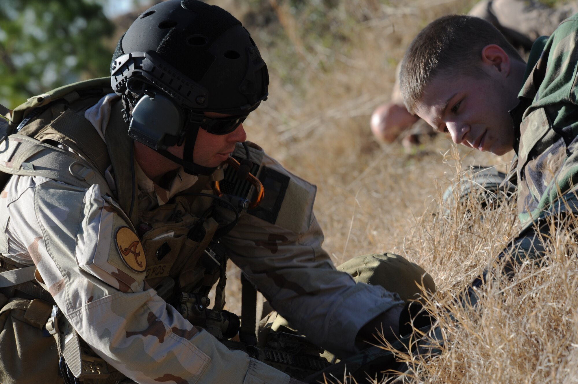 MOODY AIR FORCE BASE, Ga. -- A 38th Rescue Squadron pararescueman applies a tourniquet to a simulated casualty during a mass casualty exercise at Spence Air Field in Moultrie, Ga., Jan. 25. A tourniquet is a pressure bandage applied near a bleeding wound to stop blood flow to the injury. (U.S. Air Force photo by Airman 1st Class Benjamin Wiseman)