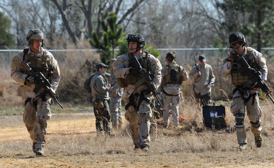 MOODY AIR FORCE BASE, Ga. -- Senior Airmen Noah Landwerlen and Jacob Schaumberg, and Staff Sgt. Eric Schanafelt, 38th Rescue Squadron pararescuemen, conduct a mock search and rescue mission during a mass casualty exercise at Spence Air Field in Moultrie, Ga., Jan. 25. The exercise is a requirement for skill level and element leader upgrades. (U.S. Air Force photo by Airman 1st Class Benjamin Wiseman)