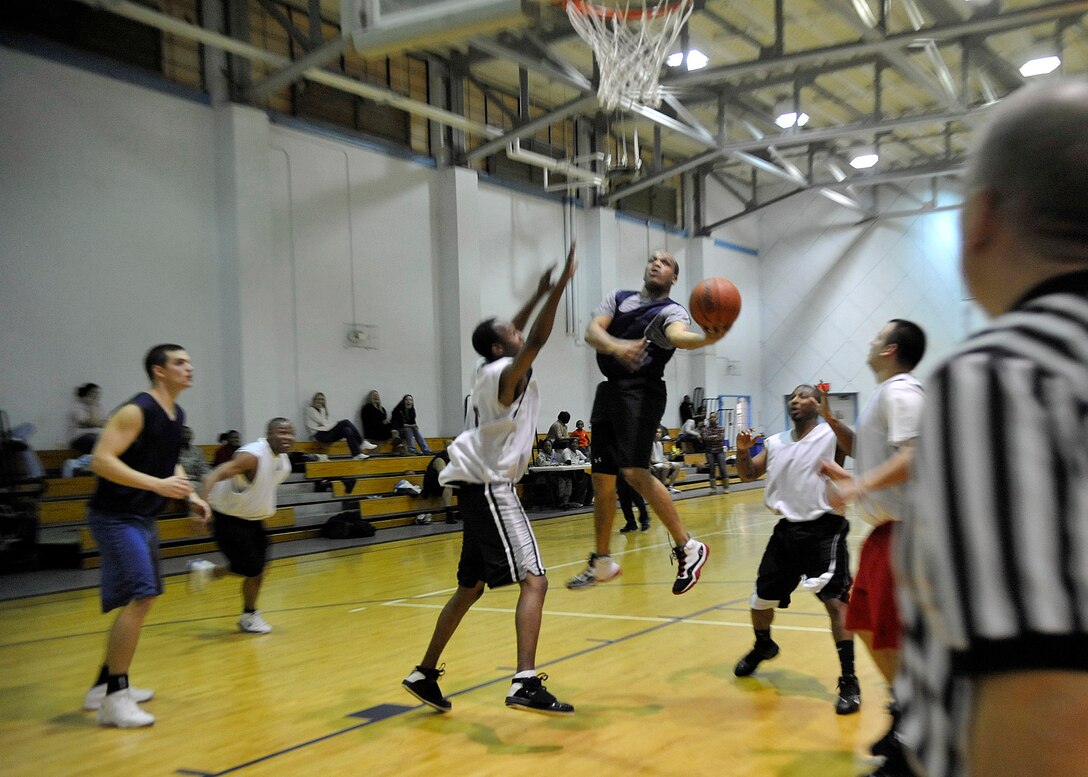 Sadarius Miley, 779th Medical Operations Squadron, performs a left-handed lay up during a basketball game versus the Fleet Readiness Center Jan. 20, 2010 at Joint Base Andrews, Md. The 779th Medical Group won the game, 48 to 36 making their record for the season 12-1. (U.S. Air Force photo by Staff Sgt. Renae L. Kleckner)