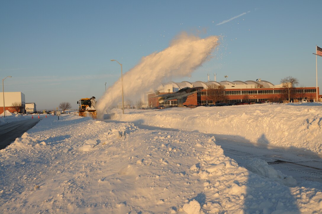 Master Sgt. Kevin Daehling blows snow from West Furnas St. onto the mall at the Nebraska Air National Guard Base on January 13, 2010. Lincoln, Neb. had a record of over 24 inches of snowfall in December 2009.(Nebraska Air National Guard photo by Senior Master Sgt. Lee Straube)