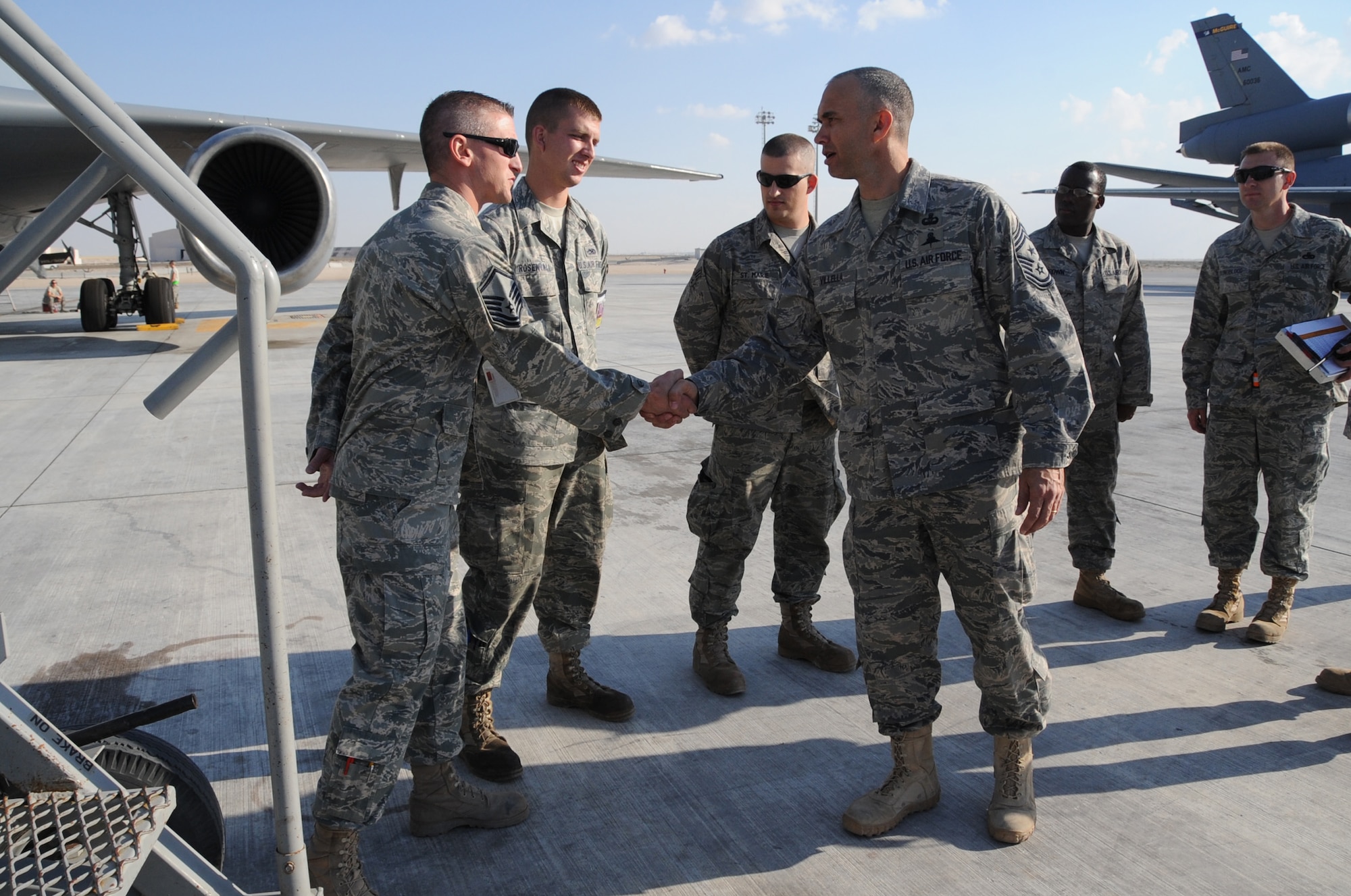 Chief Master Sgt. Mark Villella, command chief master sergeant for Air Forces Central Command, meets with KC-10 Extender maintenance Airmen during his visit to the 380th Air Expeditionary Wing at a non-disclosed base in Southwest Asia on Jan. 6, 2010.  During his visit, Chief Villella learned about the diverse mission of the 380th AEW that includes air refueling, surveillance, and reconnaissance in support of overseas contingency operations in Southwest Asia. The wing supports Operations Iraqi Freedom and Enduring Freedom and the Combined Joint Task Force-Horn of Africa. (U.S. Air Force Photo/Senior Airman Jenifer Calhoun/Released)