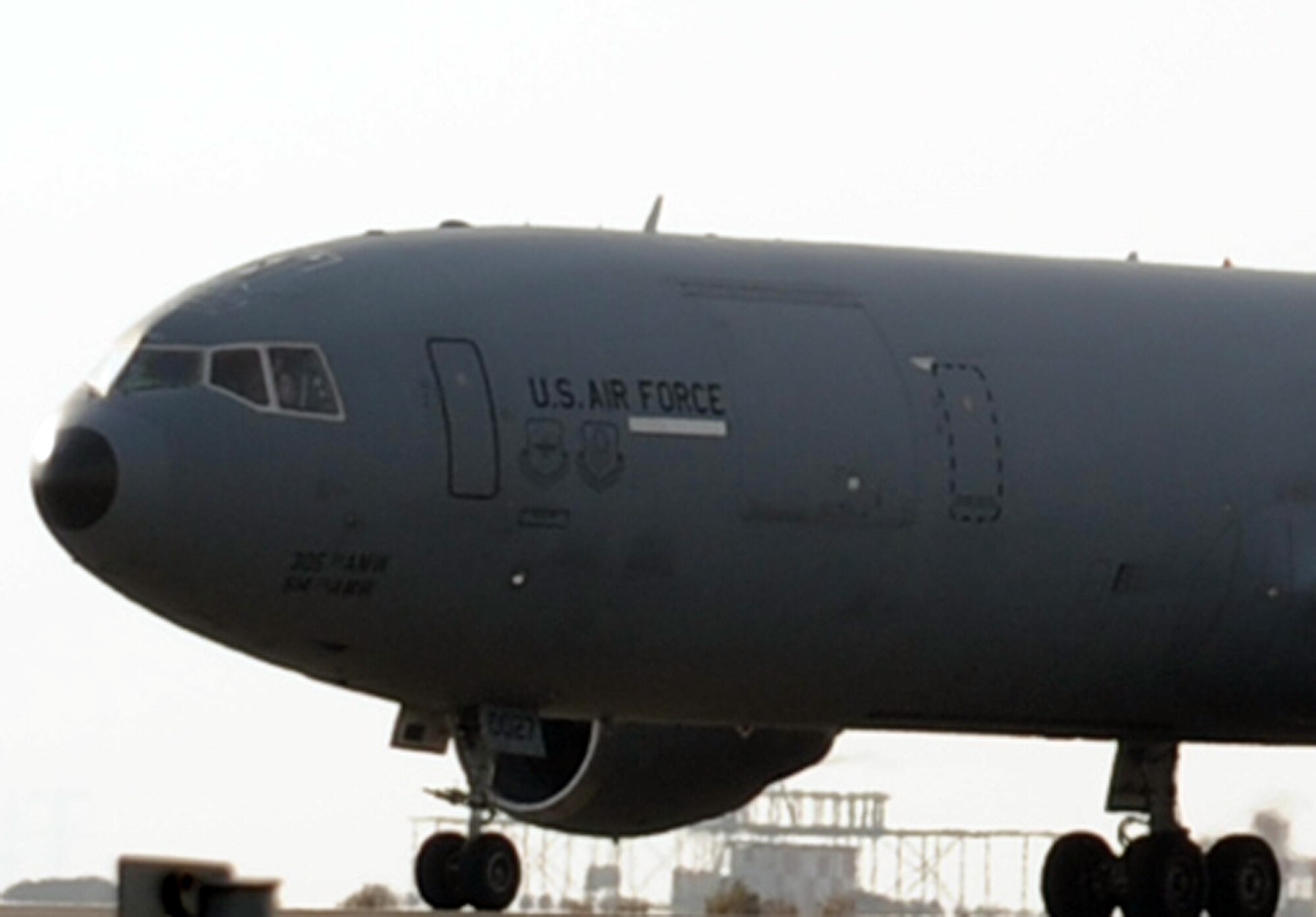 A pilot guides a KC-10 Extender as it returns from a a combat air refueling mission during operations on the flightline at a non-disclosed base in Southwest Asia on Jan. 23, 2009. The KC-10, assigned to the 908th Expeditionary Air Refueling Squadron from Joint Base McGuire-Dix-Lakehurst, N.J., is one of Air Mobility Command's air refueling aircraft deployed to the U.S. Central Command area of responsibility that provides the "global reach" for Air Force and Department of Defense aircraft through air refueling operations for Operations Iraqi Freedom and Enduring Freedom and the Combined Joint Task Force-Horn of Africa. (U.S. Air Force Photo/Tech. Sgt. Scott T. Sturkol/Released)