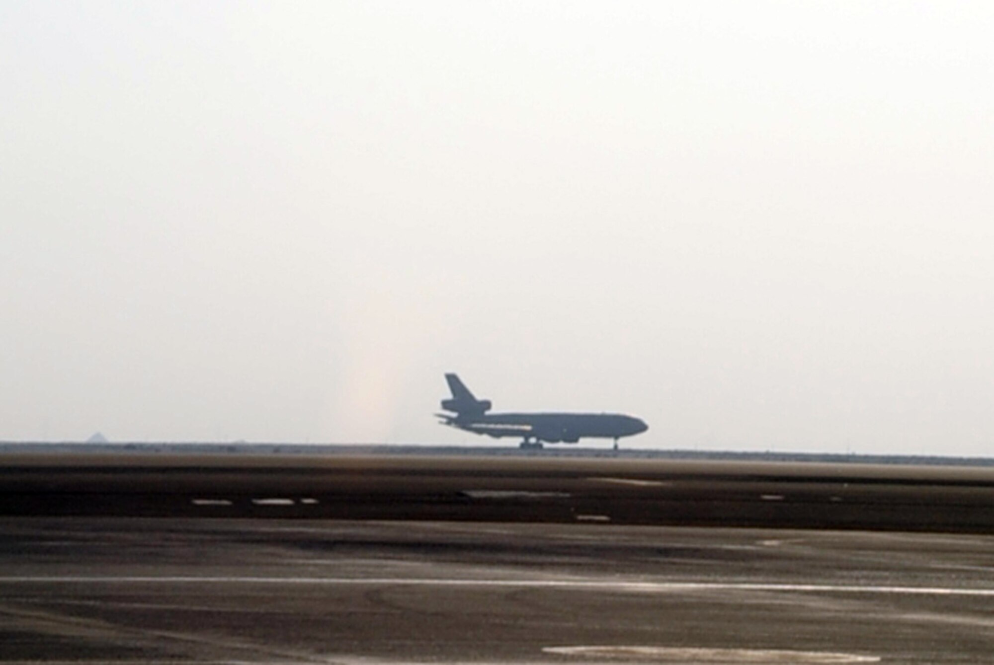 A KC-10 Extender returns from a combat air refueling mission at a non-disclosed base in Southwest Asia on Jan. 23, 2009. The KC-10, assigned to the 908th Expeditionary Air Refueling Squadron, is one of Air Mobility Command's air refueling aircraft deployed to the U.S. Central Command area of responsibility that provides the "global reach" for Air Force and Department of Defense aircraft through air refueling operations for Operations Iraqi Freedom and Enduring Freedom and the Combined Joint Task Force-Horn of Africa. (U.S. Air Force Photo/Tech. Sgt. Scott T. Sturkol/Released)