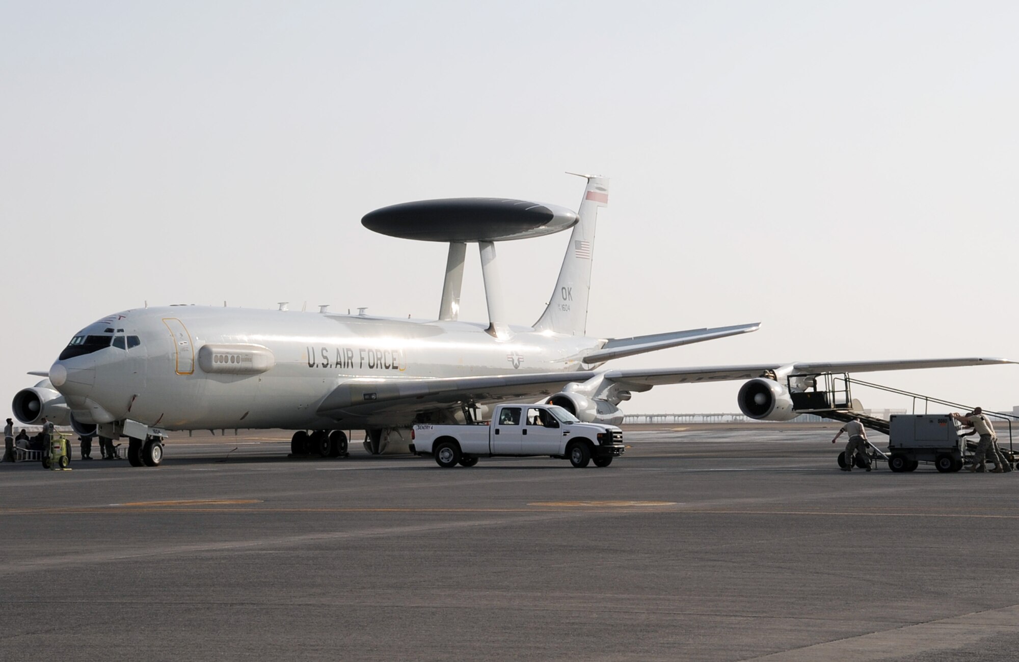 Maintenance Airmen work on an E-3 Sentry Airborne Warning and Control System aircraft during operations on the flightline at a non-disclosed base in Southwest Asia on Jan. 23, 2010.  The E-3, assigned with the 965th Airborne Air Control Squadron of the 380th Air Expeditionary Wing, is a modified Boeing 707/320 commercial airframe with a rotating radar dome that provides situational awareness of friendly, neutral and hostile activity, command and control of an area of responsibility, battle management of theater forces, all-altitude and all-weather surveillance of the battle space, and early warning of enemy actions during joint, allied, and coalition operations. (U.S. Air Force Photo/Tech. Sgt. Scott T. Sturkol/Released)