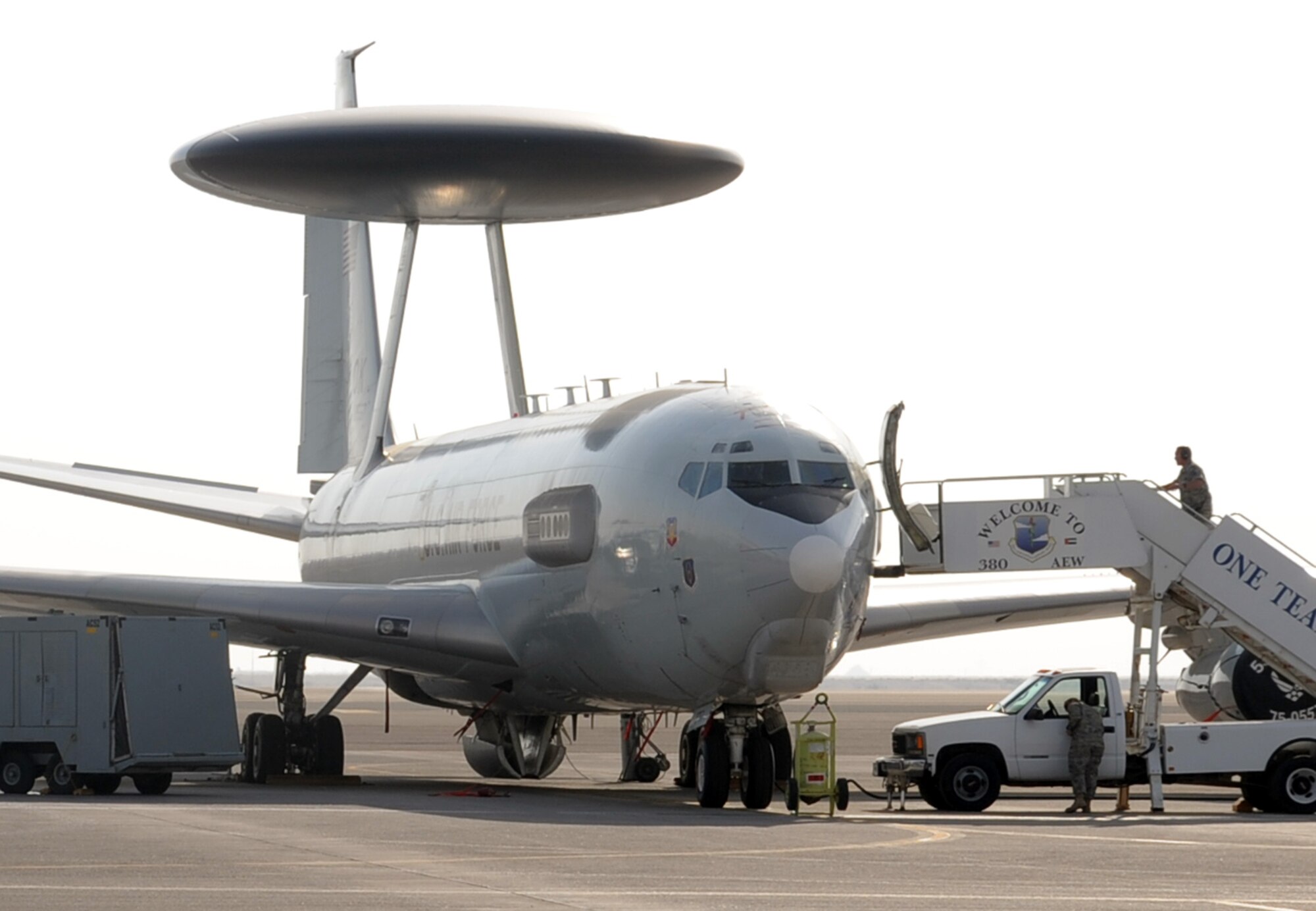 Maintenance Airmen work on an E-3 Sentry Airborne Warning and Control System aircraft during operations on the flightline at a non-disclosed base in Southwest Asia on Jan. 23, 2010.  The E-3, assigned with the 965th Airborne Air Control Squadron of the 380th Air Expeditionary Wing, is a modified Boeing 707/320 commercial airframe with a rotating radar dome that provides situational awareness of friendly, neutral and hostile activity, command and control of an area of responsibility, battle management of theater forces, all-altitude and all-weather surveillance of the battle space, and early warning of enemy actions during joint, allied, and coalition operations. (U.S. Air Force Photo/Tech. Sgt. Scott T. Sturkol/Released)