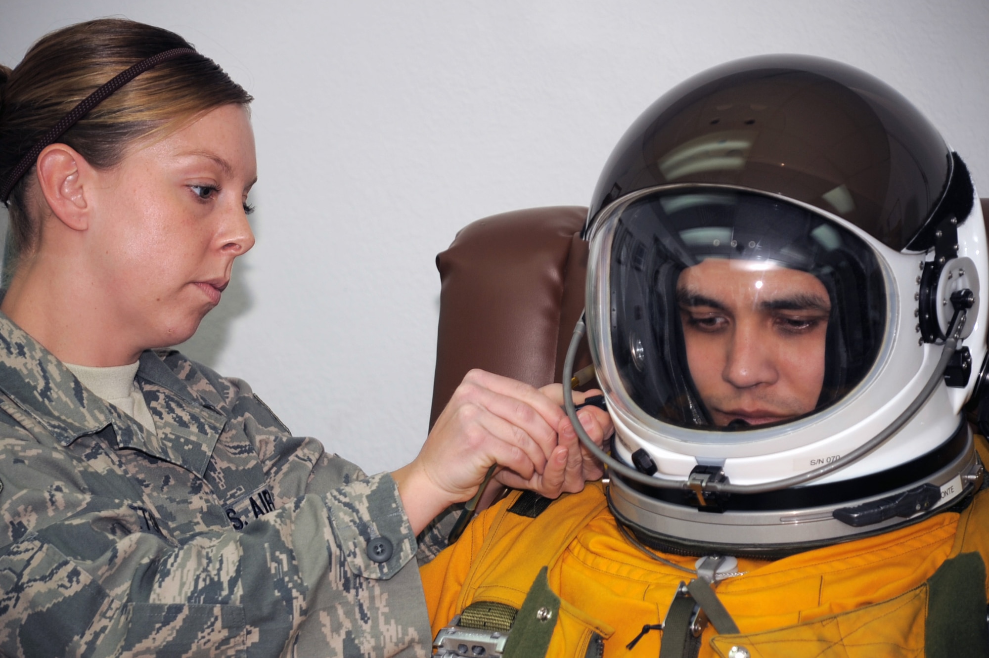 Staff Sgt. Lynnette Keeton, aerospace physiologists with the 99th Expeditionary Reconnaissance Squadron, helps gear up Capt. Tony Aponte, U-2 Dragon Lady pilot, before Captain Aponte was to go on a mission on Jan. 23, 2010, at a non-disclosed location in Southwest Asia.  Because the U-2 flies as high an altitude as 70,000 feet, pilots are required to wear a special suit to complete their mission.  The 99th ERS, part of the 380th Air Expeditionary Wing, supports Operations Iraqi Freedom and Enduring Freedom and the Combined Joint Task Force-Horn of Africa. (U.S. Air Force Photo/Tech. Sgt. Scott T. Sturkol/Released)