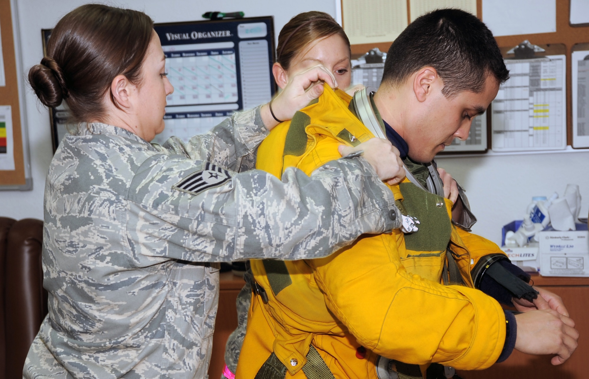 Staff Sgts. Natasha Wakefield and Lynnette Keeton, both aerospace physiologists with the 99th Expeditionary Reconnaissance Squadron, help gear up Capt. Tony Aponte, U-2 Dragon Lady pilot, before Captain Aponte was to go on a mission on Jan. 23, 2010, at a non-disclosed location in Southwest Asia.  Because the U-2 flies as high an altitude as 70,000 feet, pilots are required to wear a special suit to complete their mission.  The 99th ERS, part of the 380th Air Expeditionary Wing, supports Operations Iraqi Freedom and Enduring Freedom and the Combined Joint Task Force-Horn of Africa. (U.S. Air Force Photo/Tech. Sgt. Scott T. Sturkol/Released)