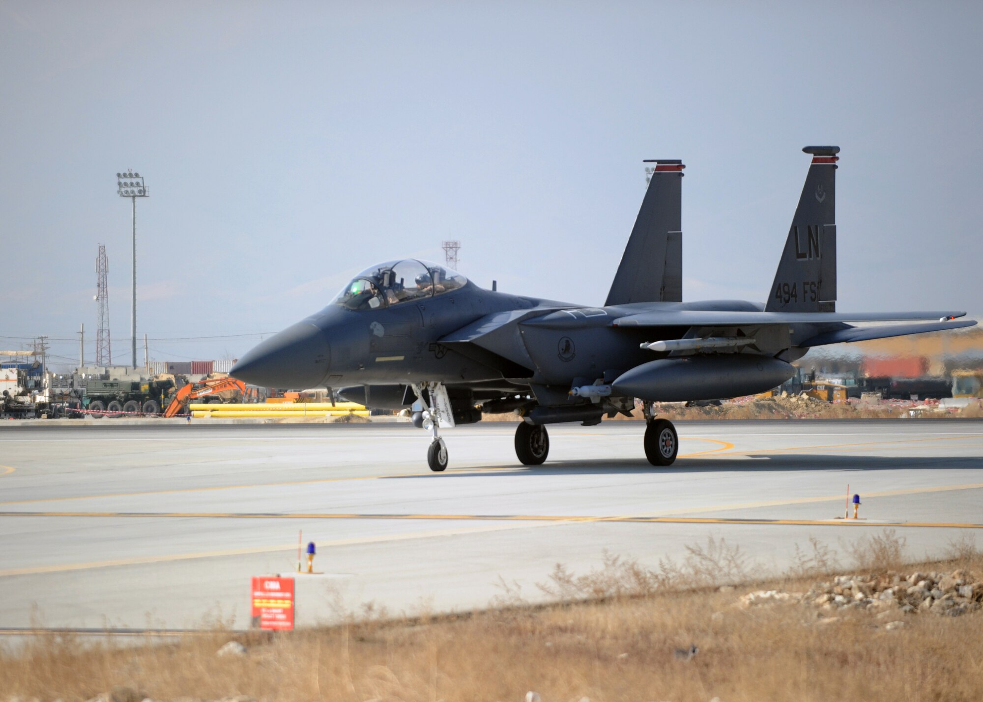 BAGRAM AIRFIELD, Afghanistan -- A pilot assigned to the 494th Expeditionary Fighter Squadron taxis his F-15E Strike Eagle to a parking place on the close air support ramp at Bagram Airfield, Jan. 24, 2010. The 494th EFS is deployed from the 48th Fighter Wing, Royal Air Force Lakenheath, England, in support of Operation Enduring Freedom. (U.S. Air Force photo by/Staff Sgt. Richard Williams)